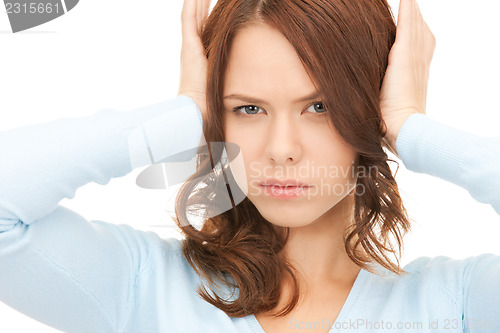 Image of woman with hands on ears