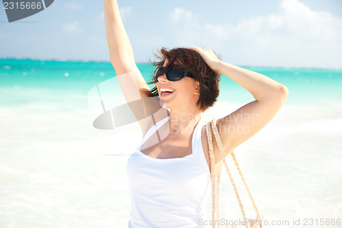 Image of happy woman at the beach