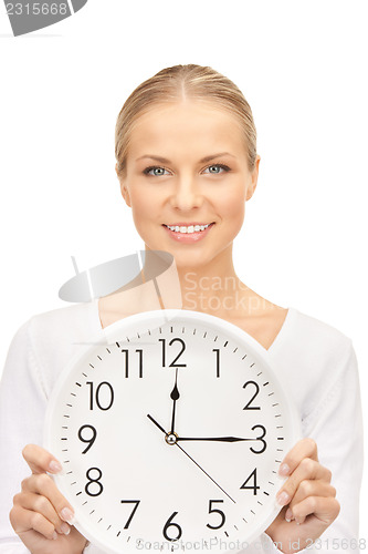 Image of woman holding big clock