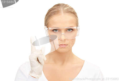 Image of woman in protective glasses and gloves