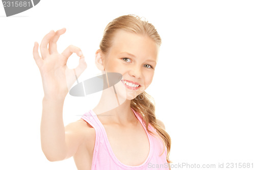 Image of lovely girl showing ok sign