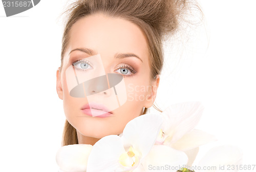 Image of beautiful woman with white flower