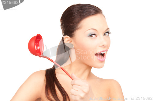 Image of beautiful housewife with red ladle 