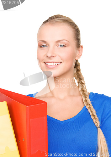 Image of young attractive businesswoman with folders
