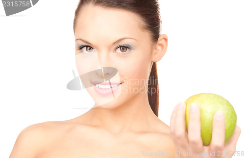 Image of young beautiful woman with green apple