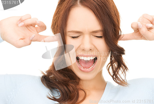 Image of woman with fingers in ears