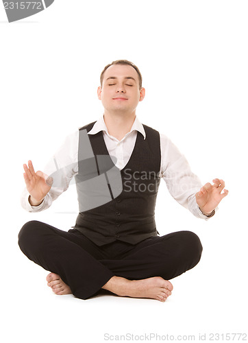 Image of businessman sitting in lotus pose