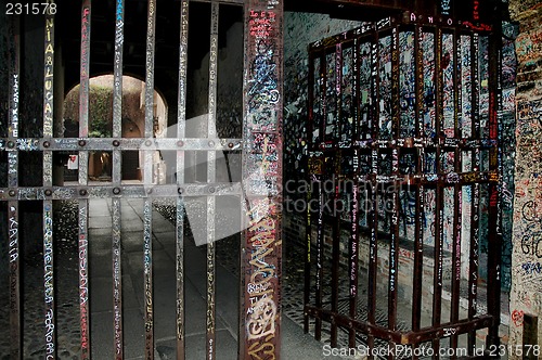 Image of Gate with graffiti