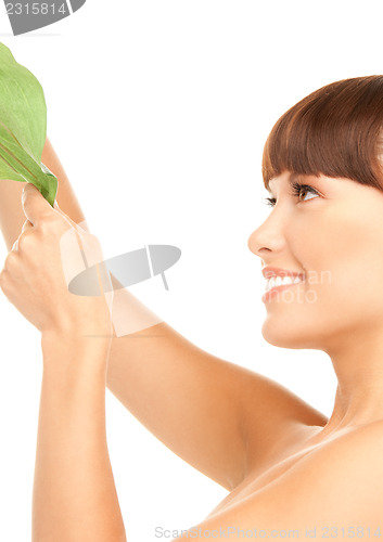 Image of woman with green leaf