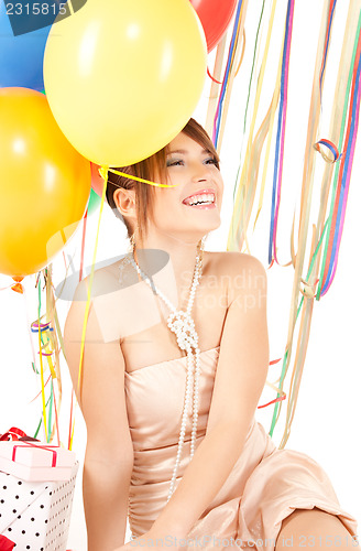 Image of party girl with balloons and gift box
