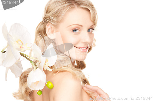 Image of beautiful woman with white flower