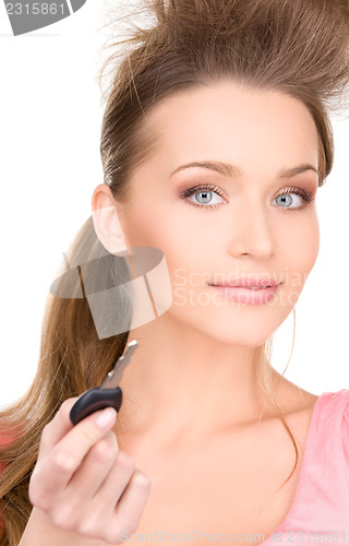 Image of happy woman with car key