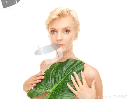 Image of woman with green leaf