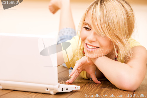 Image of teenage girl with laptop computer