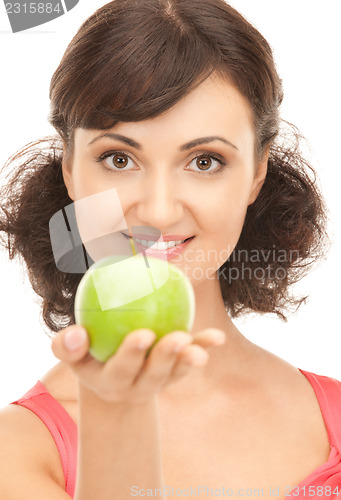 Image of young beautiful woman with green apple