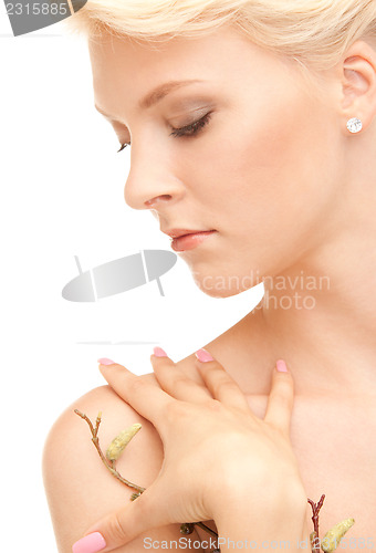 Image of lovely woman with twig