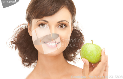 Image of young beautiful woman with green apple