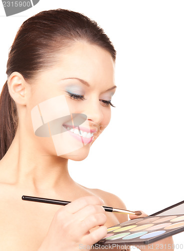 Image of lovely woman with palette and brush