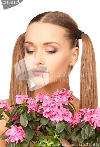 Image of lovely housewife with flowers