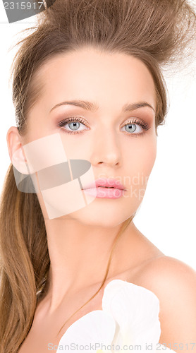 Image of beautiful woman with white flower