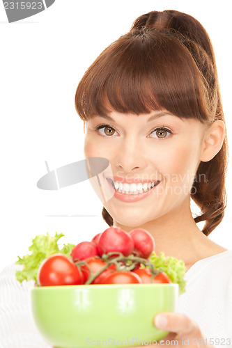 Image of beautiful housewife with vegetables