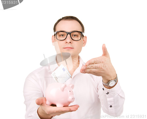 Image of businessman with piggy bank and money