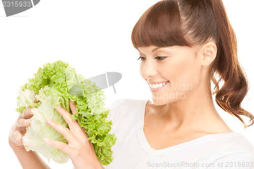 Image of beautiful housewife with lettuce over white
