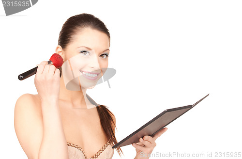 Image of lovely woman with palette and brush