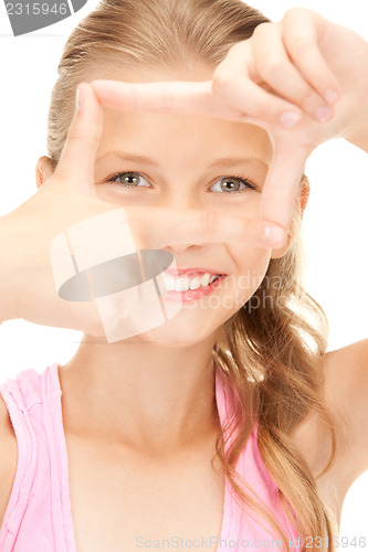 Image of pretty girl creating a frame with fingers