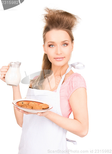 Image of housewife with milk and cookies