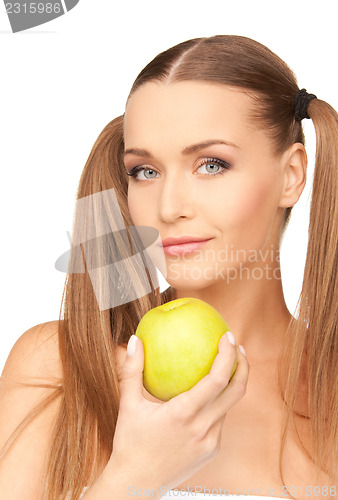 Image of young beautiful woman with green apple