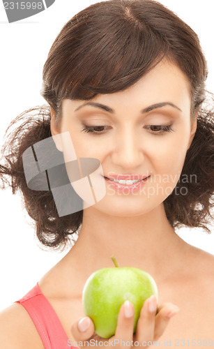 Image of young beautiful woman with green apple
