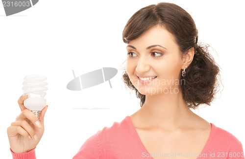 Image of woman holding energy saving bulb