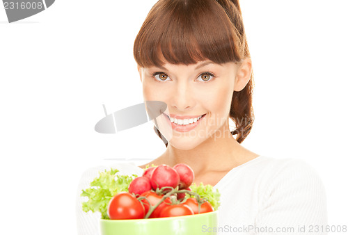 Image of beautiful housewife with vegetables