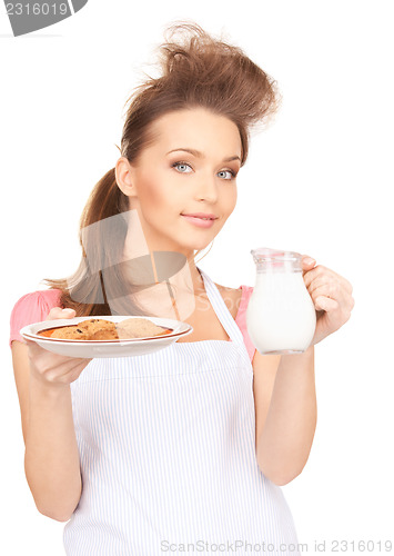 Image of housewife with milk and cookies