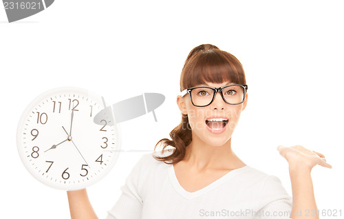 Image of woman holding big clock