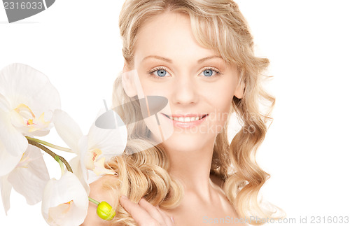 Image of beautiful woman with white flower
