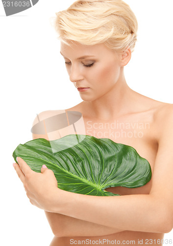 Image of woman with green leaf