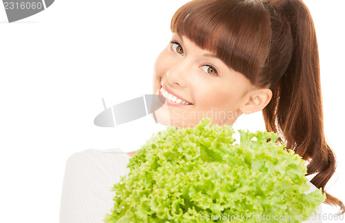 Image of beautiful housewife with lettuce over white