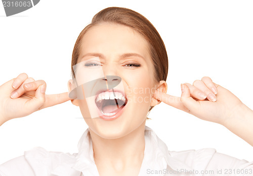 Image of woman with fingers in ears