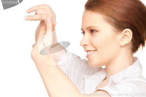 Image of lovely woman creating a frame with fingers