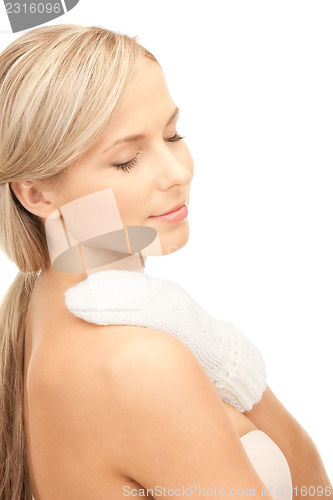 Image of beautiful woman in white mittens