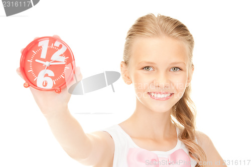 Image of girl holding alarm clock