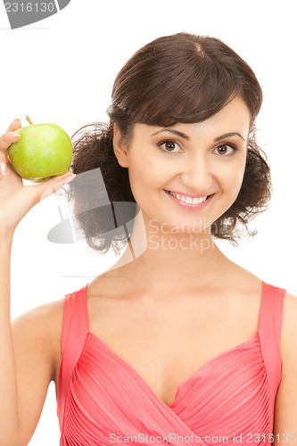 Image of young beautiful woman with green apple
