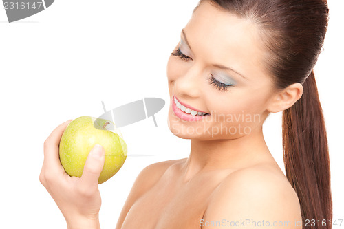 Image of young beautiful woman with green apple