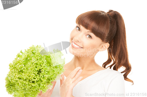 Image of beautiful housewife with lettuce over white