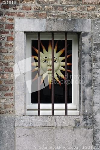 Image of Sun behind bars