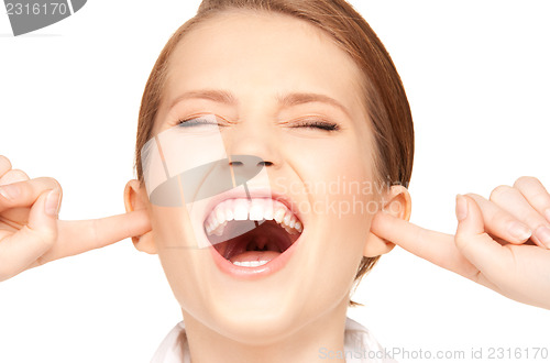 Image of woman with fingers in ears