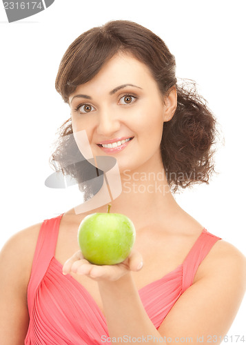 Image of young beautiful woman with green apple
