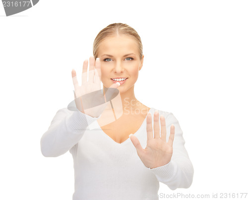Image of businesswoman working with something imaginary